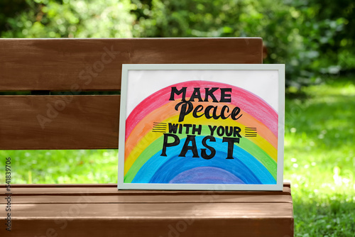 Phrase Make Peace With Your Past written on poster outdoors