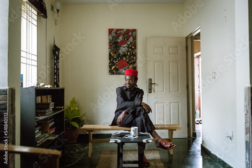 an igbo man posing for portraits in his home photo