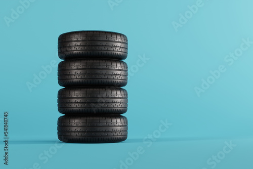 Tires on a blue pastel background. Wheel change concept, vulcanization. Seasonal tire change. 3d render, 3d illustration. © Sebastian