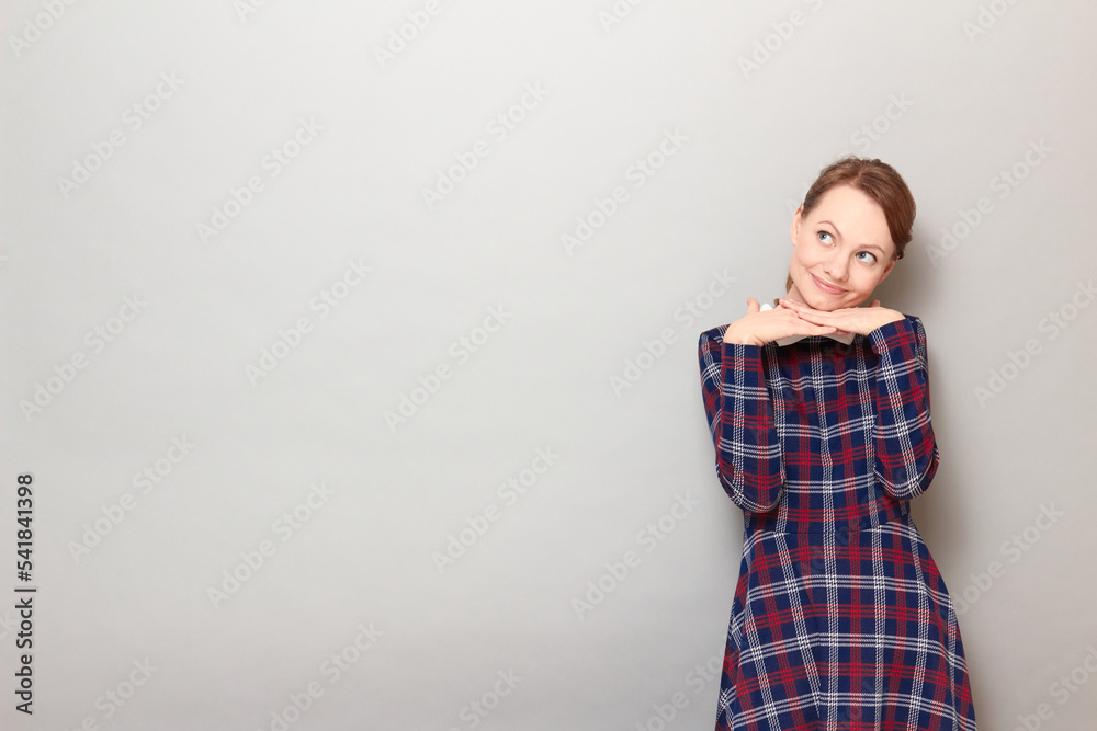 Portrait of happy dreamy young woman imagining something in mind Portrait of happy dreamy young woman imagining something in mind