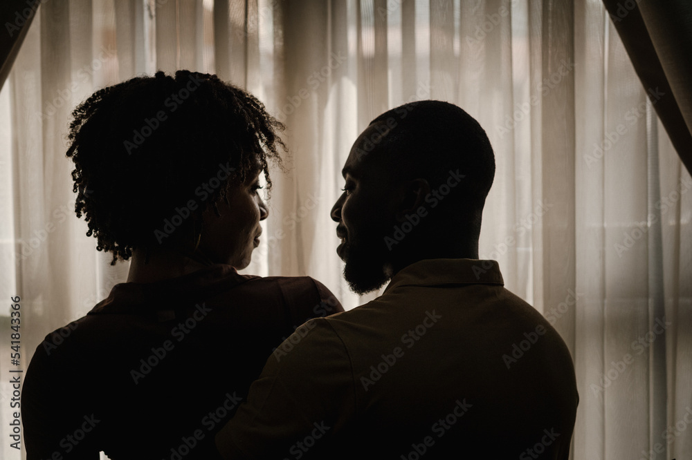 silhouette of a black couple