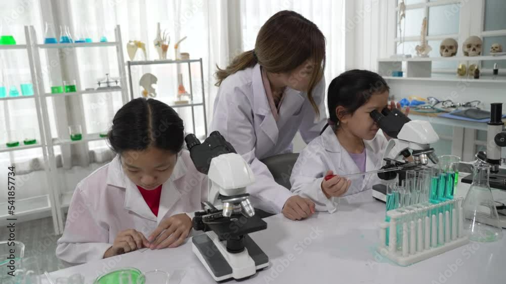 Young Asian Children Learning Science and Medicine with Teacher at School Classroom Young Asian Children Learning Science and Medicine with Teacher at School Classroom