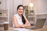 Portrait business woman smile and use tablet checking information .Asian people having online business meeting, video conferencing .