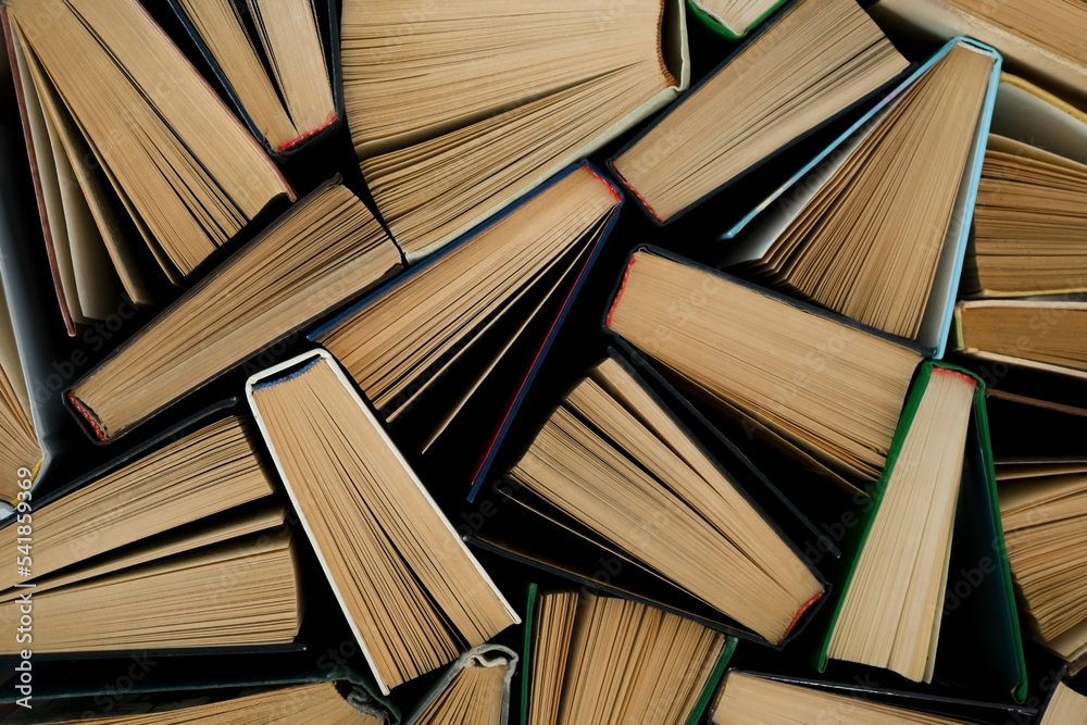 Fototapeta premium background from many books. Book view from above. reading culture. High quality photo