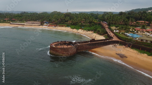 Goa, India 19th October 2022: Drone shots Fort Aguada in North Goa - Seventeenth-century Portuguese fort standing on Sinquerim Beach. Popular also Watersports activities and white sand beach.   photo