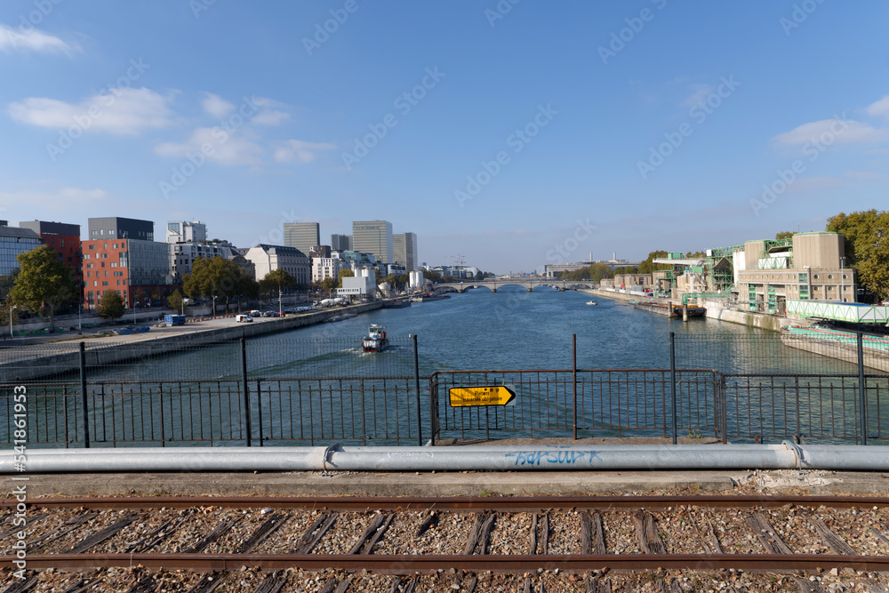 Fototapeta premium Seine river and railway sign on the Petite Ceinture Paris' Abandoned Railway. 12th arrondissement of Paris city