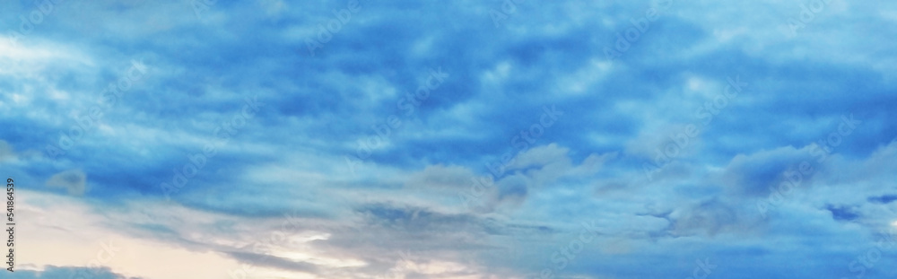 Beautiful clear light blue sky with white clouds in sunny day. Wallpaper background. Beautiful clear light blue sky with white clouds in sunny day. Wallpaper background.