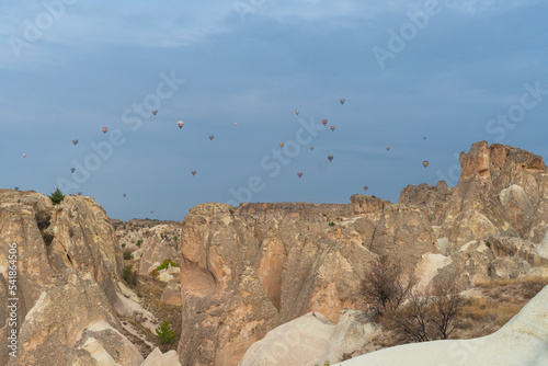 Morning balloon flight over the mountains in Cappadocia, Turkey photo