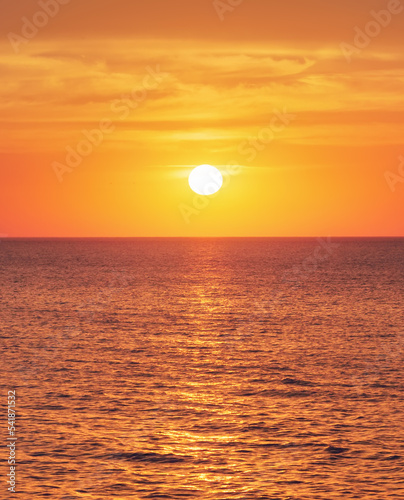 Bright sunset under the sea surface