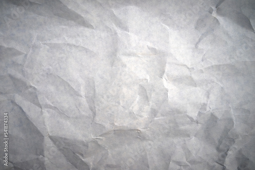 Gray background of crumpled paper. Crumpled texture for collage. Crumpled white background.