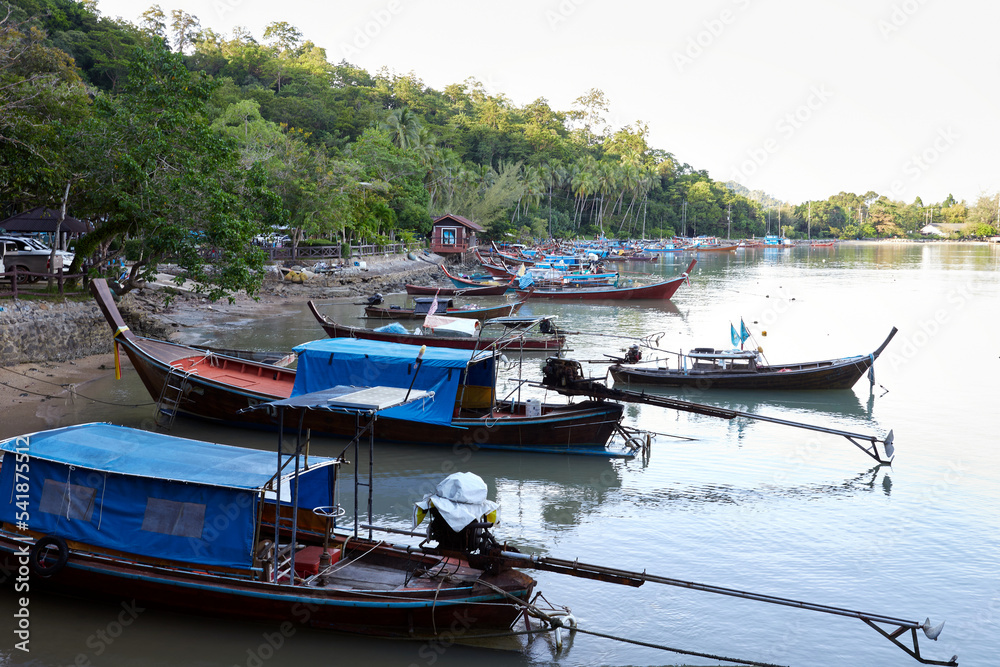 Fishing boats docking on the beach at Mu Ko Phetra in Thailand