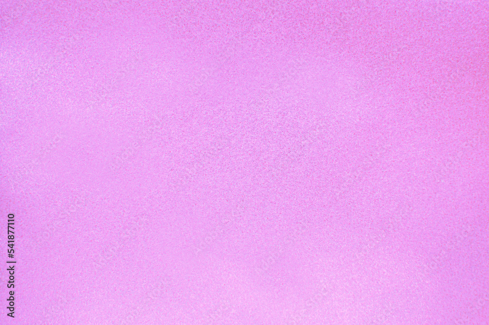 Background with pink sequins. Shiny textured surface.Out of focus.Vertical image
