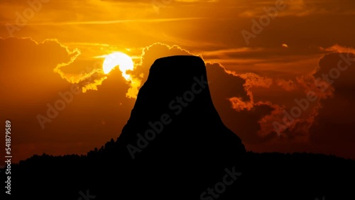Devils Tower: Time Lapse at Sunset with Red Sun and Fiery Sky, Wyoming, USA