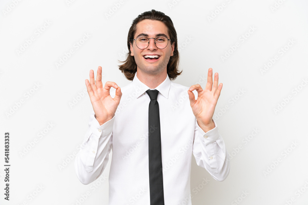 Business handsome man isolated on white background showing an ok sign with fingers Business handsome man isolated on white background showing an ok sign with fingers