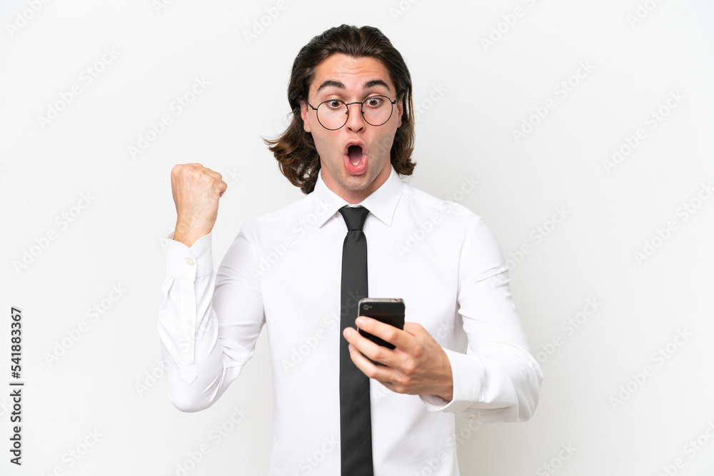 Business handsome man isolated on white background surprised and sending a message Business handsome man isolated on white background surprised and sending a message