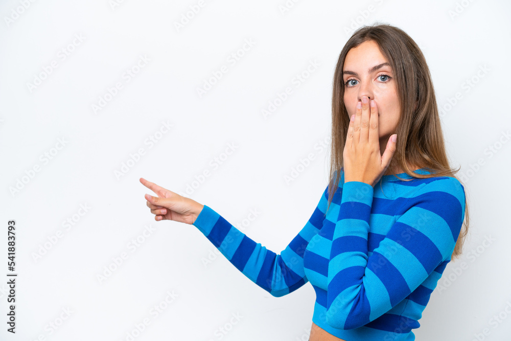 Young caucasian woman isolated on white background with surprise expression while pointing side Young caucasian woman isolated on white background with surprise expression while pointing side