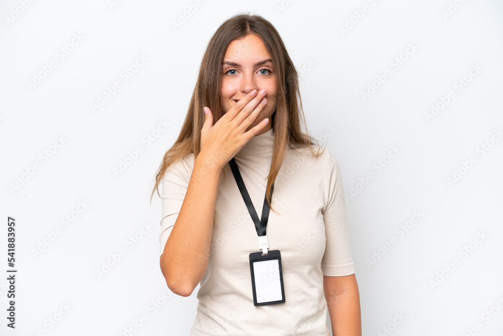 Young pretty woman with ID card isolated on white background happy and smiling covering mouth with hand Young pretty woman with ID card isolated on white background happy and smiling covering mouth with hand