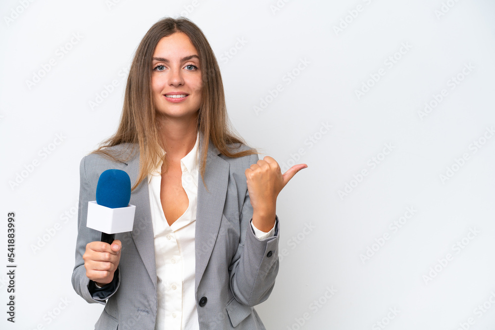 Young TV presenter caucasian woman isolated on white background pointing to the side to present a product Young TV presenter caucasian woman isolated on white background pointing to the side to present a product