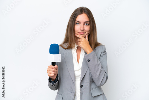 Young TV presenter caucasian woman isolated on white background thinking