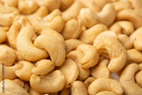 Cashew nuts as a background, top view. Cashew isolated on white background. Healthy foods.