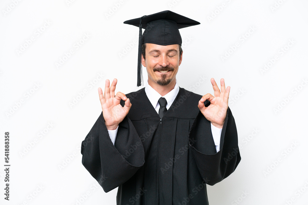 Young university graduate man isolated on white background in zen pose Young university graduate man isolated on white background in zen pose