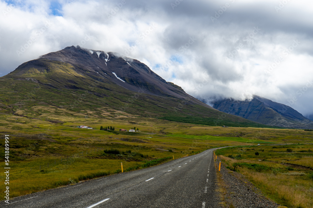 Mountain road under gloomy skies in Iceland