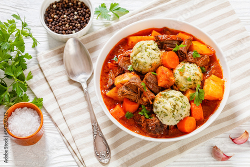 Beef Stew with Dumplings in bowl, top view