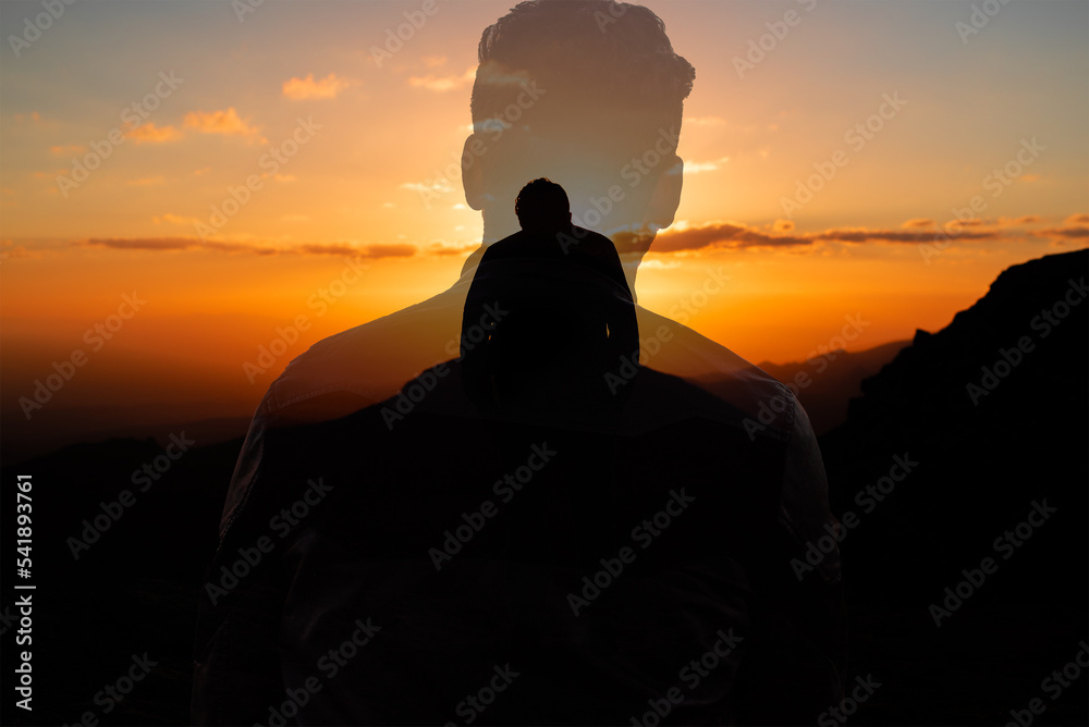 double exposure men in edge of mountain with dramatic scene