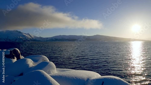 Cloud and Sun Over Winter Norwegian Fjord