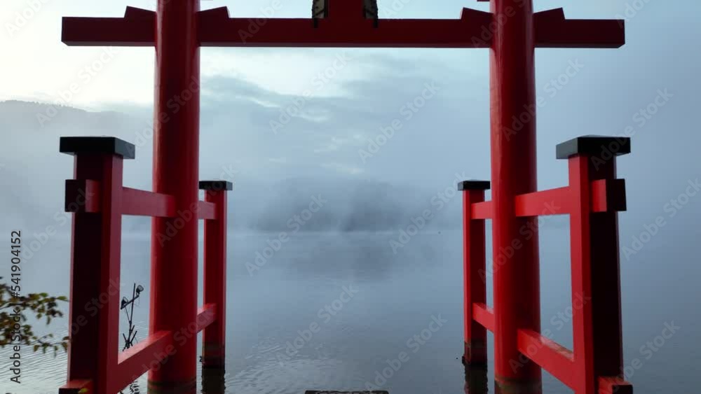 Japanese shrine, traditional Japanese torii on a lake, flying through torii in Japan on a foggy mystical morning, Japanese iconic tourist landmark Japanese shrine, traditional Japanese torii on a lake, flying through torii in Japan on a foggy mystical morning, Japanese iconic tourist landmark