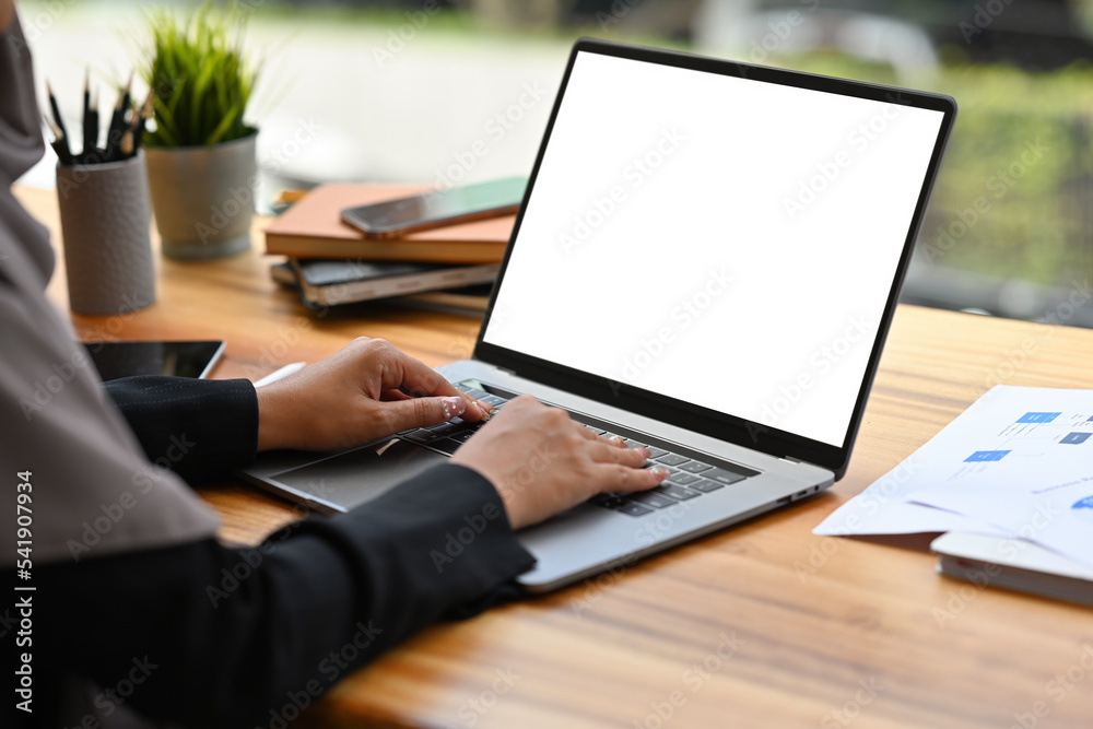 Close up with Arabian Businesswoman working with laptop, Empty screen of laptop. Close up with Arabian Businesswoman working with laptop, Empty screen of laptop.