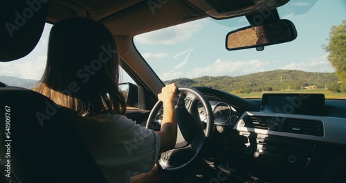 Woman drive vehicle at vacation road trip nature with mountain view