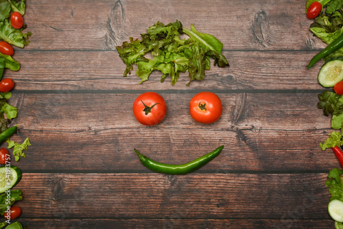 Fresh organic vegetables on wood background. Flat lay, top view with space for text. Healthy lifestyles concept