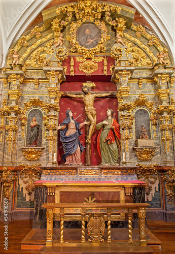 TOLEDO - MARCH 8: Crucifixion baroque statue with hl. Mary and saint John from church Iglesia de san Idefonso  photo