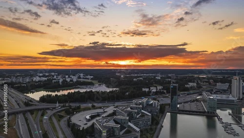 Aerial hyper-lapse of the Keilaniemi neighborhood of Espoo, Finland. Amazing sunset over the city. Summer evening.