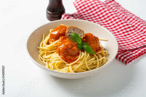 Close up of tasty spaghetti with meat balls in bowl selective focus food