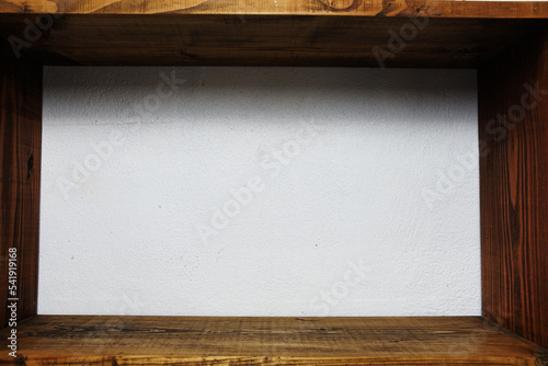 Wooden sEmpty wood shelf on concrete wall and wooden backgroundhelf photo