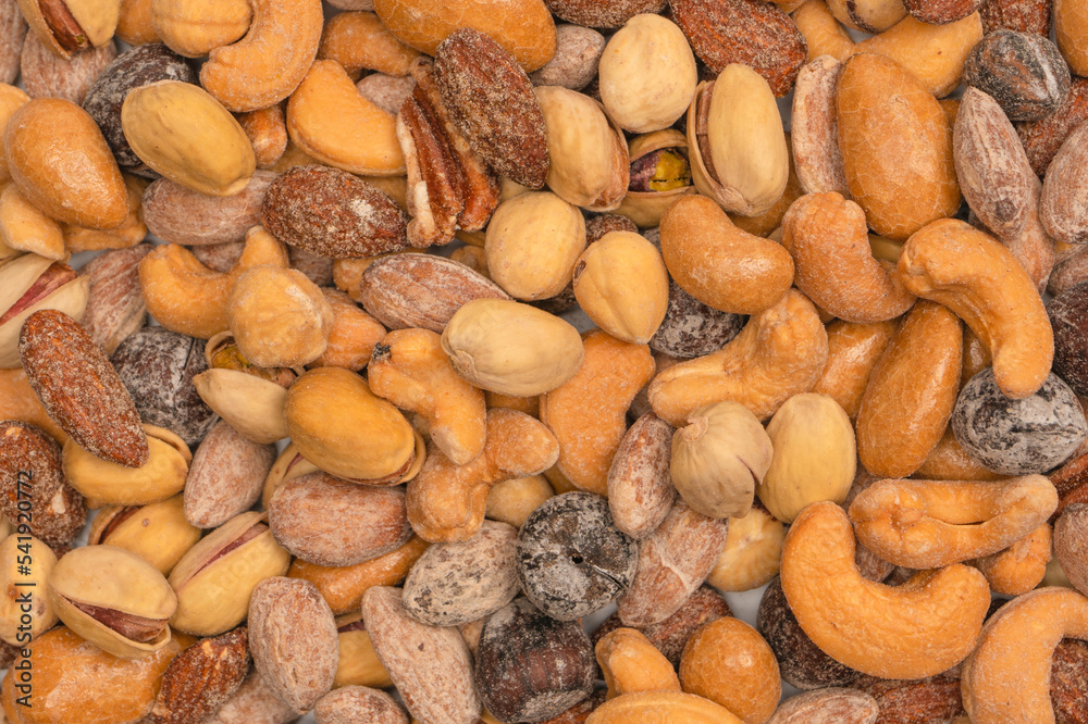  A group of almonds, pistachios, walnuts, macadamia, cashews.