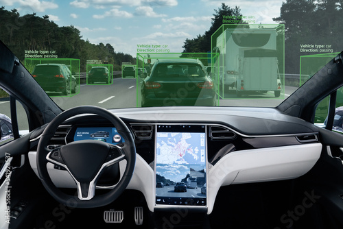 Self driving car on a road. Autonomous vehicle. Inside view.	