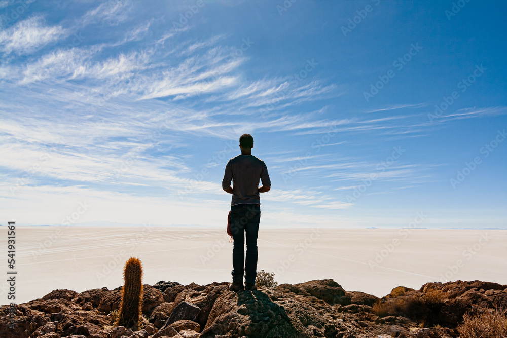 Man looking at infinity in the Salar de Uyuni, Bolovia Man looking at infinity in the Salar de Uyuni, Bolovia