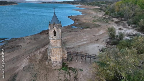 Aerial view from a drone of the church of Villanueva in the municipality of Las Rozas de Valdearroyo. Ebro reservoir. Cantabria. Spain. Europe photo