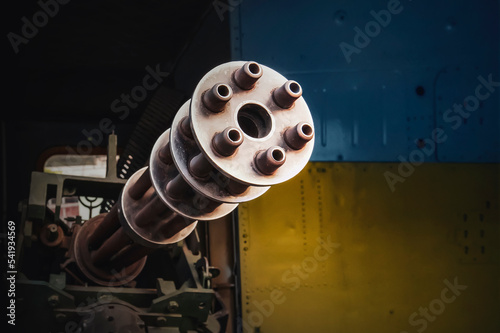 Minigun machine gun on the background of the flag of Ukraine. concept of war and defense. photo