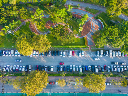 Aerial view transport city road through tree park with vehicle