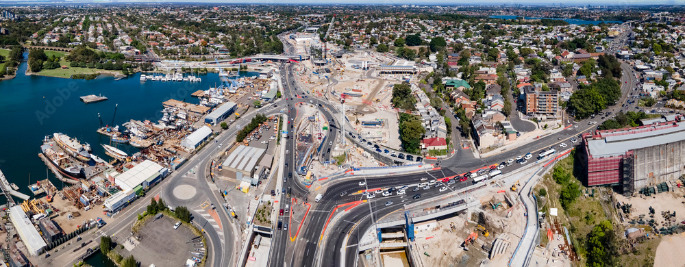 Panoramic aerial drone view of Rozelle Interchange showing major construction works heading west along Victoria Road and City West Link on a sunny day in October 2022  