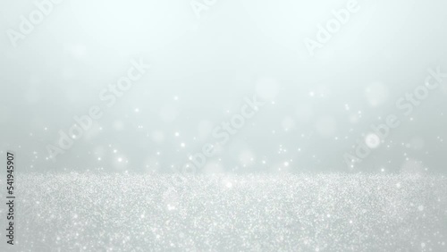 Beautiful glitter background with white gradation. It creates a fantastic and romantic winter. Loop playback is supported.