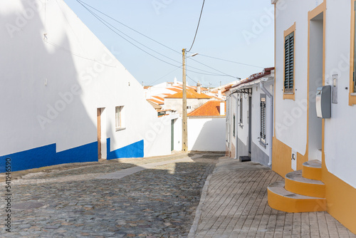 a street with traditional white houses in Ervidel, municipality of Aljustrel, district of Beja, Alentejo, Portugal photo