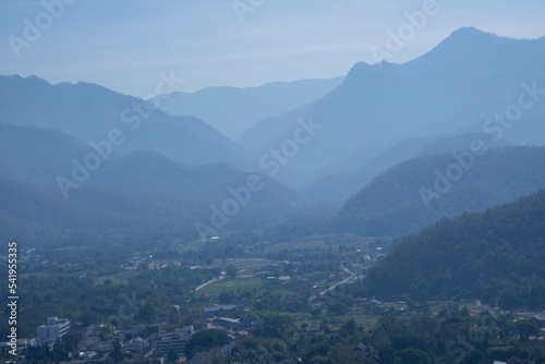 Beautiful high mountain multi layer with green tree. high forest fresh air and fog in morning sunrise blue sky. Thailand tropical view in natural park. © Topfotolia
