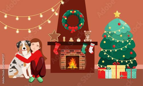 A girl with a dog by the fireplace and a Christmas tree. Cozy home.