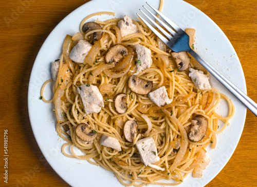 spaghetti with sauteed onions, mushrooms and chicken photo