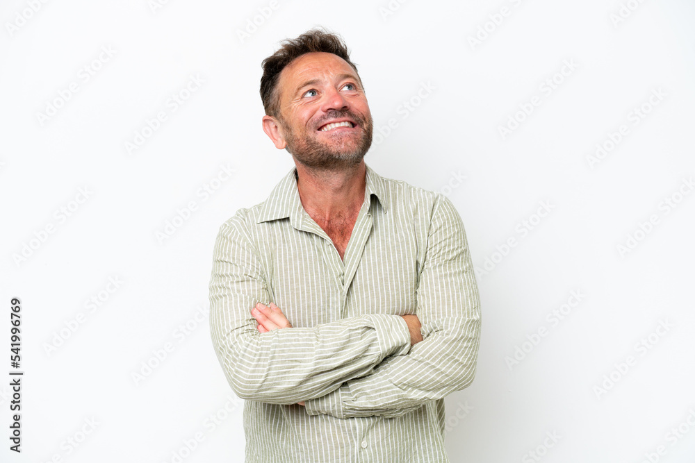 Middle age caucasian man isolated on white background looking up while smiling Middle age caucasian man isolated on white background looking up while smiling